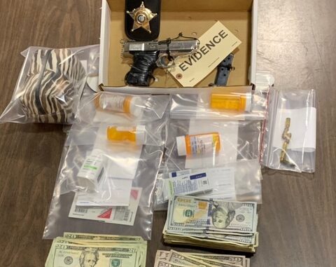 Drugs, cash and a .380 handgun were confiscated after an early morning raid near Chadbourn. (CCSO Photo)