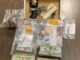Drugs, cash and a .380 handgun were confiscated after an early morning raid near Chadbourn. (CCSO Photo)
