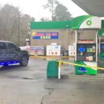 Crime scene tape surrounded the gas pumps and front door of the Sam's Pit Stop Saturday after a man was stabbed.