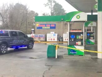 Crime scene tape surrounded the gas pumps and front door of the Sam's Pit Stop Saturday after a man was stabbed.