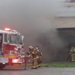 Firefightersprepare to enter the closed Radio Shack during Friday's fire.