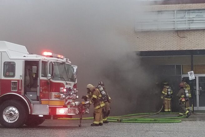 Firefightersprepare to enter the closed Radio Shack during Friday's fire.