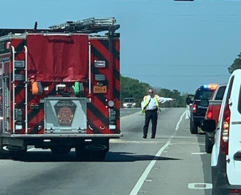 WFD Chief David Yergeau directs traffic at the wreck on J.K. Powell Boulevard and Hay Street. (Ben Proctor photo)