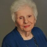 A woman wearing a blue outfit