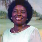 A woman wearing a white dress