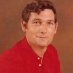 A man wearing a red shirt