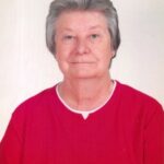 A man wearing a red and white shirt  