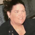 A woman wearing a black top