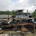 Nothing remains of the warehouse on Magnolia Street after an early morning fire Monday.