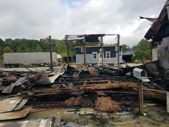 Nothing remains of the warehouse on Magnolia Street after an early morning fire Monday.
