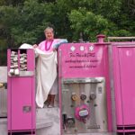 A woman wearing a pink outfit