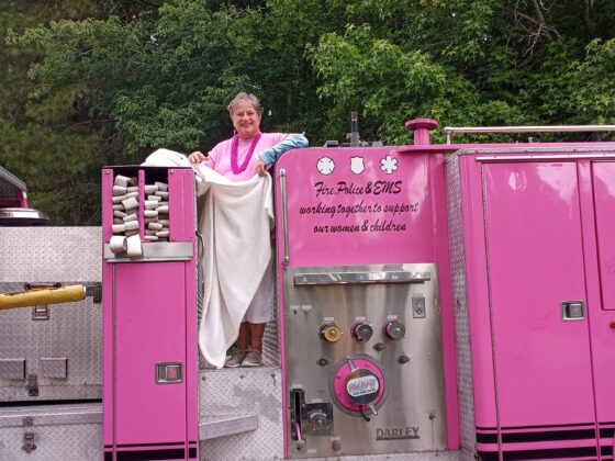 A woman wearing a pink outfit