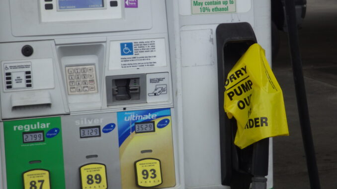 Yellow out of order bags cover gas nozzles at many stations across the area.