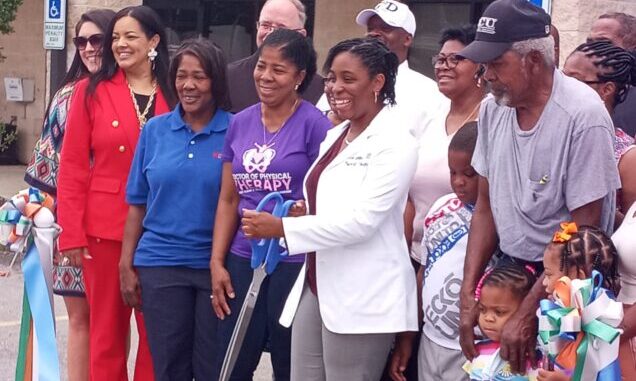 Dr. A. Nicole Jenkins is surrounded by family and friends as she officially opened her practice in Whiteville.