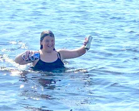 Lakyn Wilson took it upon herself to collect bottles and cans from Lake Waccamaw after a another girl cut her foot on a broken bottle.