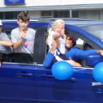 The Central Columbus Dixie Darlings Rolle dthrough downtown Whiteville this morning en route to the state championships.