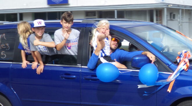 The Central Columbus Dixie Darlings Rolle dthrough downtown Whiteville this morning en route to the state championships.
