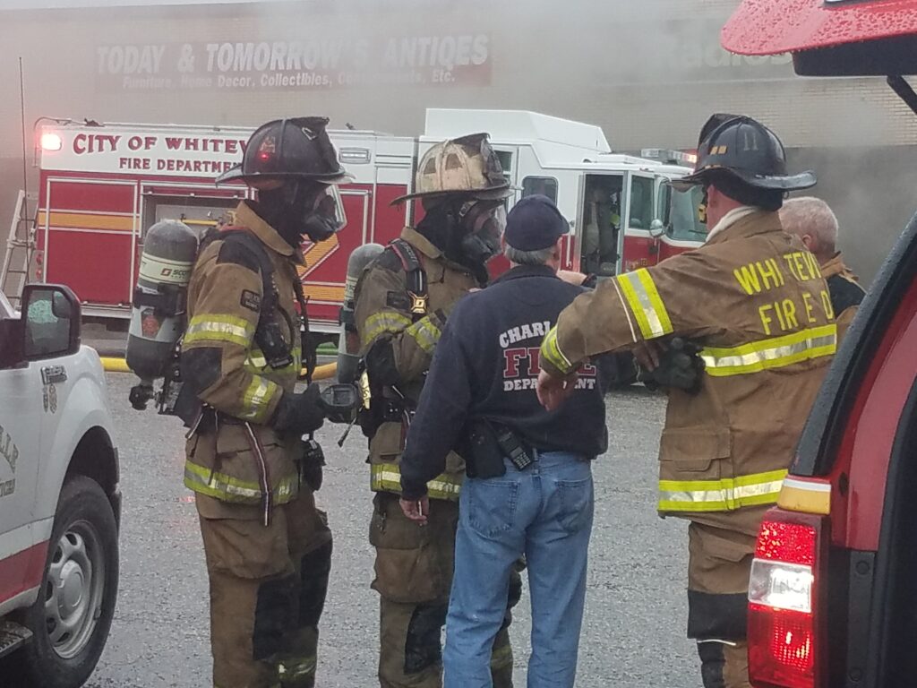 Firefighters battled the Lewis Smith Shopping center blaze for hours in February. The city council will consider bids Tuesday for final demolition of the property. (file photo)