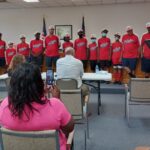 Mayor Daniel Hilburn reads the resolution honoring the DYB World Champion Riegelwood team Tuesday.