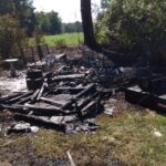 The blaze destroyed this outbuilding near a home in Wooded Acres Friday (today).