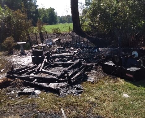 The blaze destroyed this outbuilding near a home in Wooded Acres Friday (today).