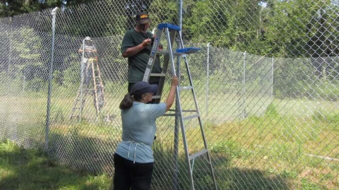Volunteers spent the Sept. 11 working on new fences at the wildcat rescue. (submitted photo)