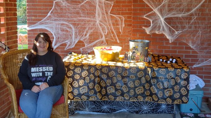 Christy Harrelson with some of her decorations, waiting for early trick or treaters.