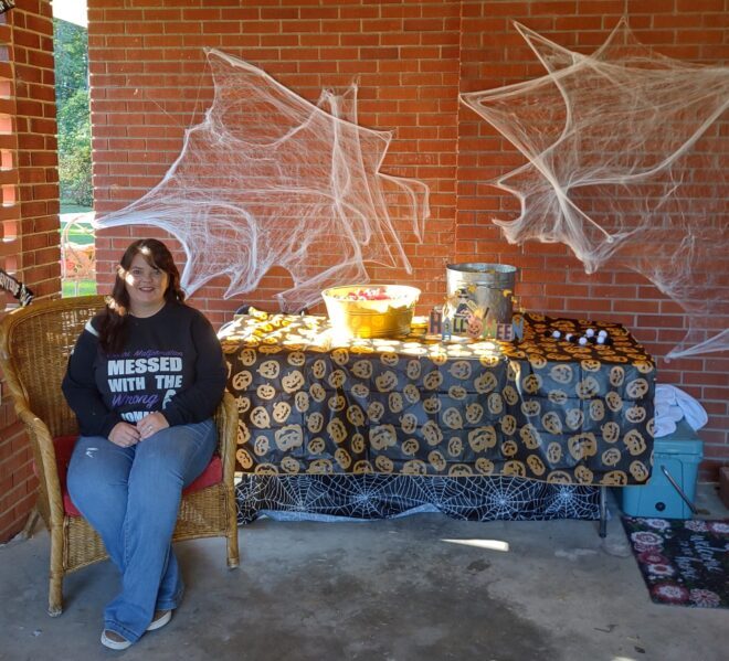 Christy Harrelson with some of her decorations, waiting for early trick or treaters.