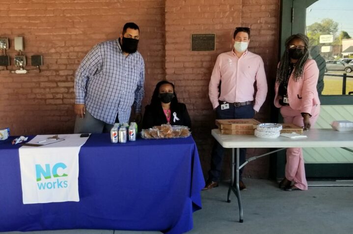 People staffing the NCWorks booth had snacks and pizza for jobseekers. (Jeff Allen photo)