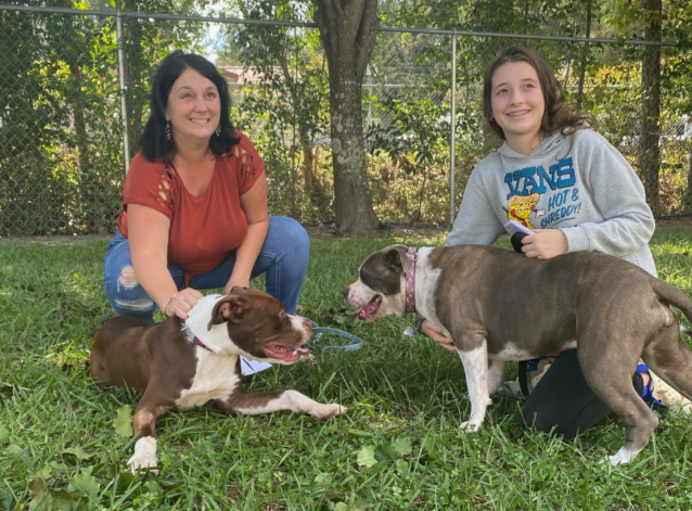 Trooper (left) with his new family. Changes at Animal protective Services helped get Trooper the assistance he needed much faster. (Submitted photo)