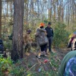 Abernatrhy is greeted by family after his overnight ordeal in the Green Swamp. (CCSO photo)
