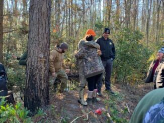 Abernatrhy is greeted by family after his overnight ordeal in the Green Swamp. (CCSO photo)