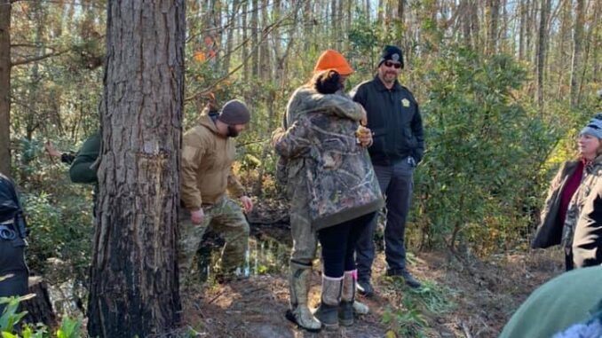 Abernatrhy is greeted by family after his overnight ordeal in the Green Swamp. (CCSO photo)