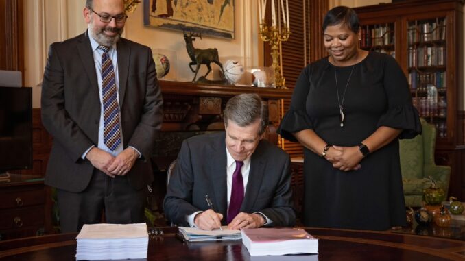 Gov. Roy Cooper signed the state's first new budget since 2017 into law today. (Courtesy Governor's Office)