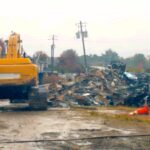 Piles of debris behind the old Lewis Smith Shopping Center were apparently set on fire Thursday evening.
