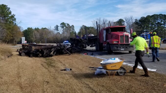 A logging truck rolled over and lost its load at U.S. 74 and Red Hill Road at Whiteville Friday morning.
