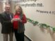 Sheriff Jody Greene presents Wallace Todd with the more than $1,800 raised by the sheriff's office for Community CPR's Christmas efforts. (submitted photo)