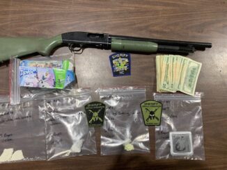 Opiates, cocaine, cash and this shotgun were seized during a raid on an alleged drug dealer's home Jan. 4. (CCSO)