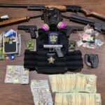 Firearms, drugs, cash and body armor were confiscated in the raid. (CCSO photo)