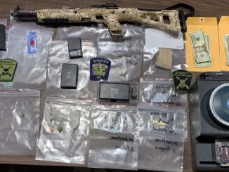 Drugs, cash and a firearm were seized after a raid in bolton. (CCSO photo)