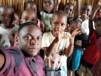 Edward Nsubugu and some of the orphans he cares for in Uganda.