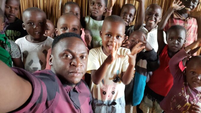 Edward Nsubugu and some of the orphans he cares for in Uganda.