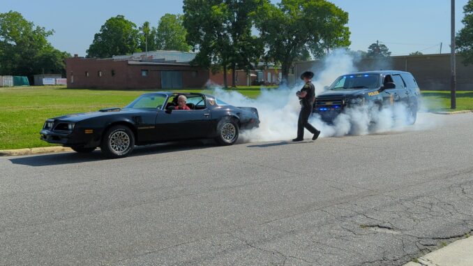 Robbie Turner and Nick Forester of the TCPD during their homage to the classic chase movie, Smokey and the Bandit. (Crystal Edwards photo)