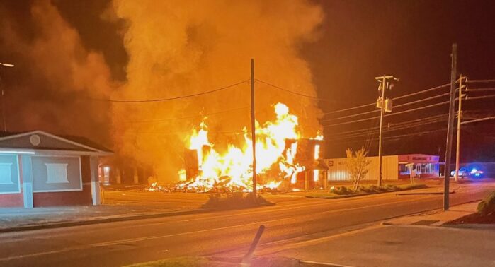 Flames shoot through the remains of one of the buildings at the Budget Inn early Wednesday. (Fire Marshal photo)