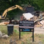 Sheriff Jody Greene wasted no time after announcing the nuisance abatement order against this property on Dessie Road. The sheriff manned the excavator used to demolish the home right after Friday's press conference. (submitted).