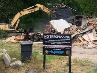 Sheriff Jody Greene wasted no time after announcing the nuisance abatement order against this property on Dessie Road. The sheriff manned the excavator used to demolish the home right after Friday's press conference. (submitted).
