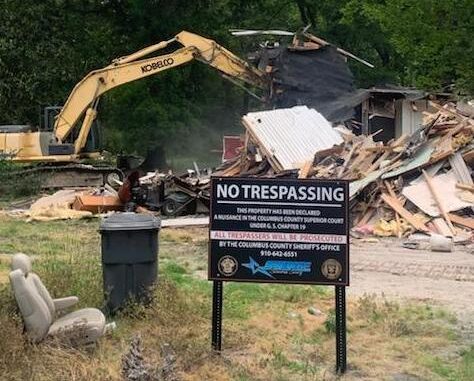 Sheriff Jody Greene wasted no time after announcing the nuisance abatement order against this property on Dessie Road. The sheriff manned the excavator used to demolish the home right after Friday's press conference. (submitted).