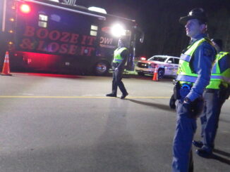 Officers manning a checkpoint with the BAT-Mobile last year. (file photo)