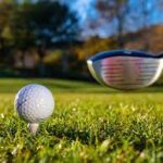A golf ball and golf club