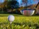 A golf ball and golf club